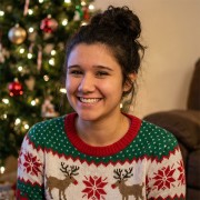 Smiling young woman wearing a holiday sweater